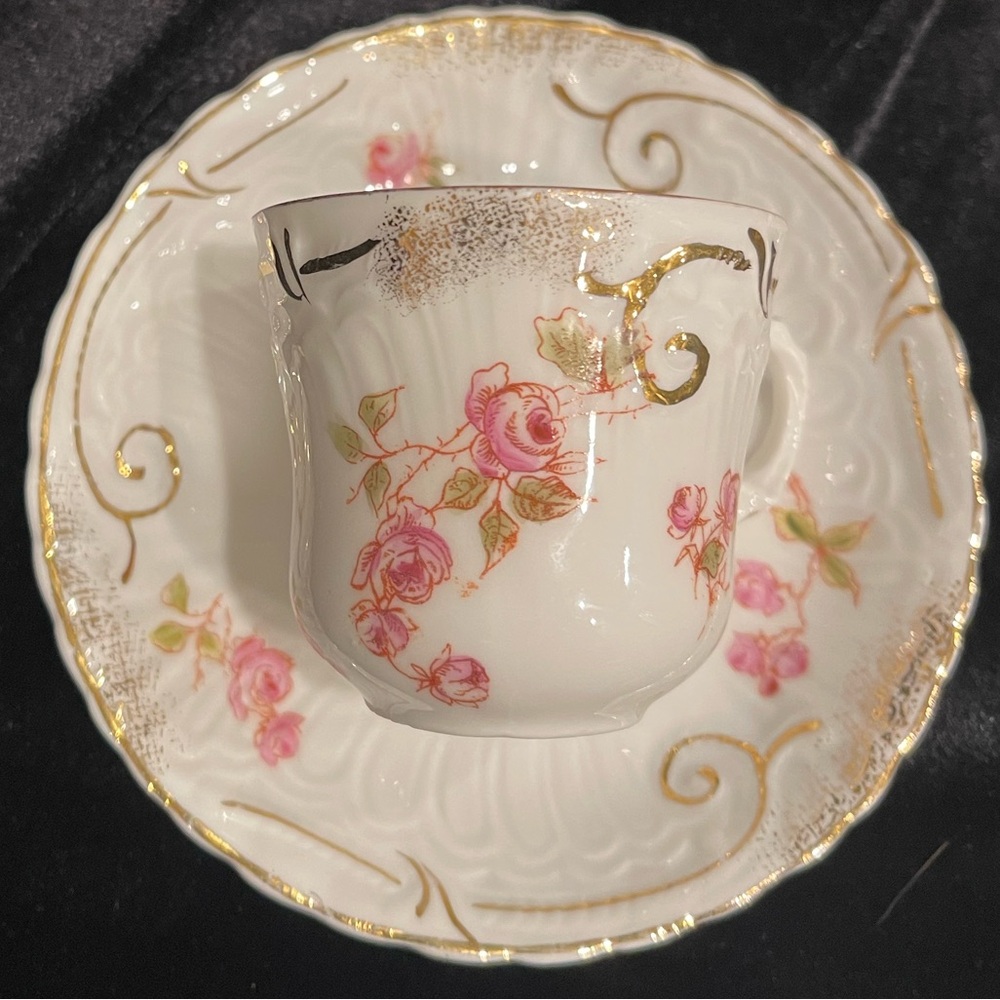 Limoges-style demitasse cup and saucer.  No chips or cracks - some gilt loss.